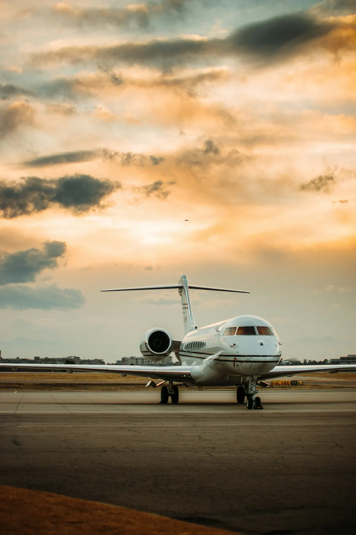 Large cabin jet under a sunset sky